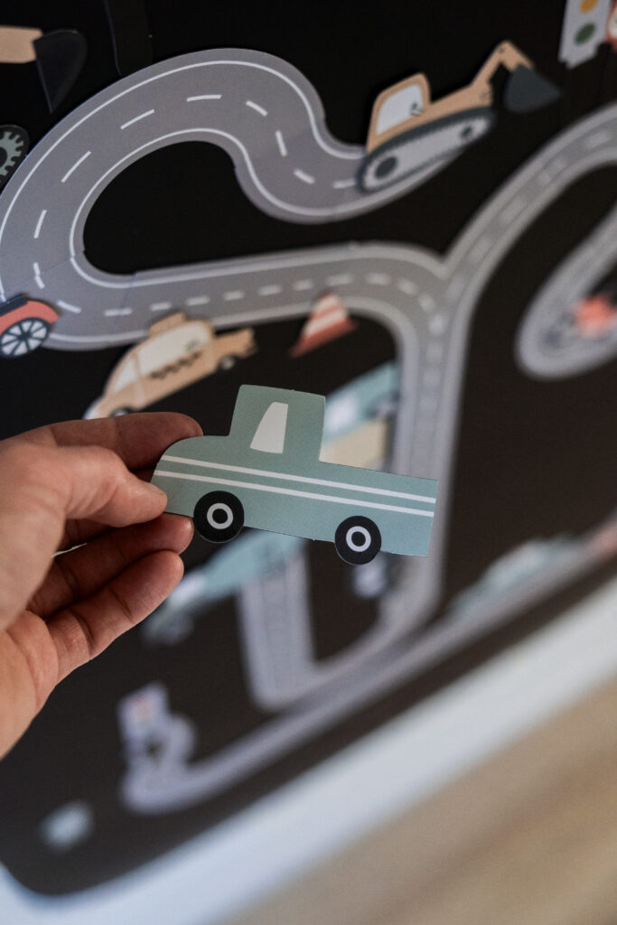 Set of magnets featuring vehicles, roads and a road map on a magnetic sticker